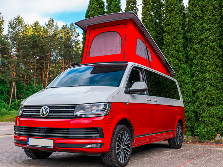 Volkswagen T6 red camper van with a pop top roof.