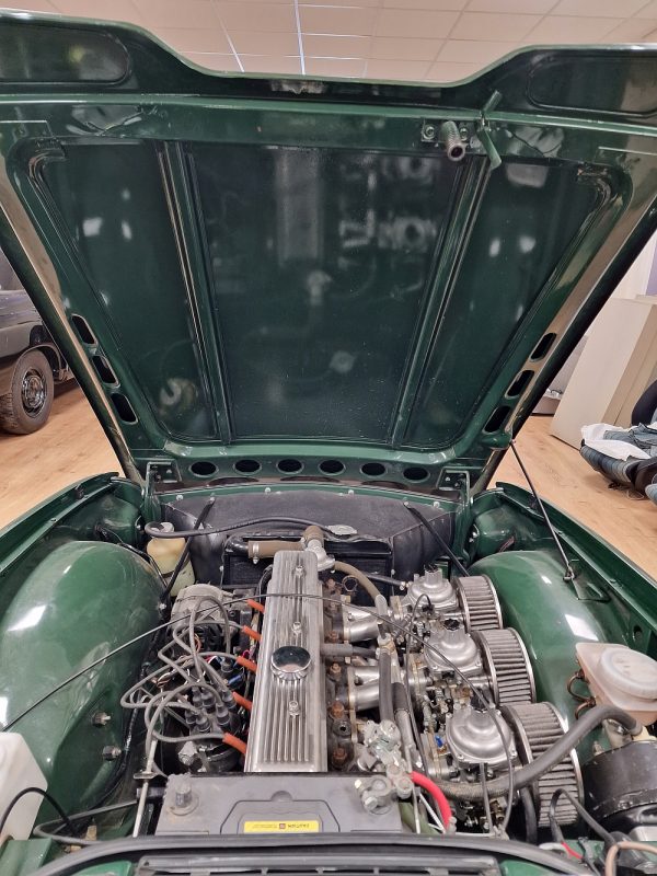 Underside of a vintage car bonnet before insulation