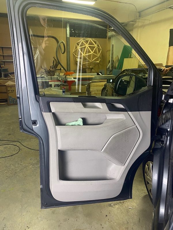 Van front door with the door card refitted after soundproofing